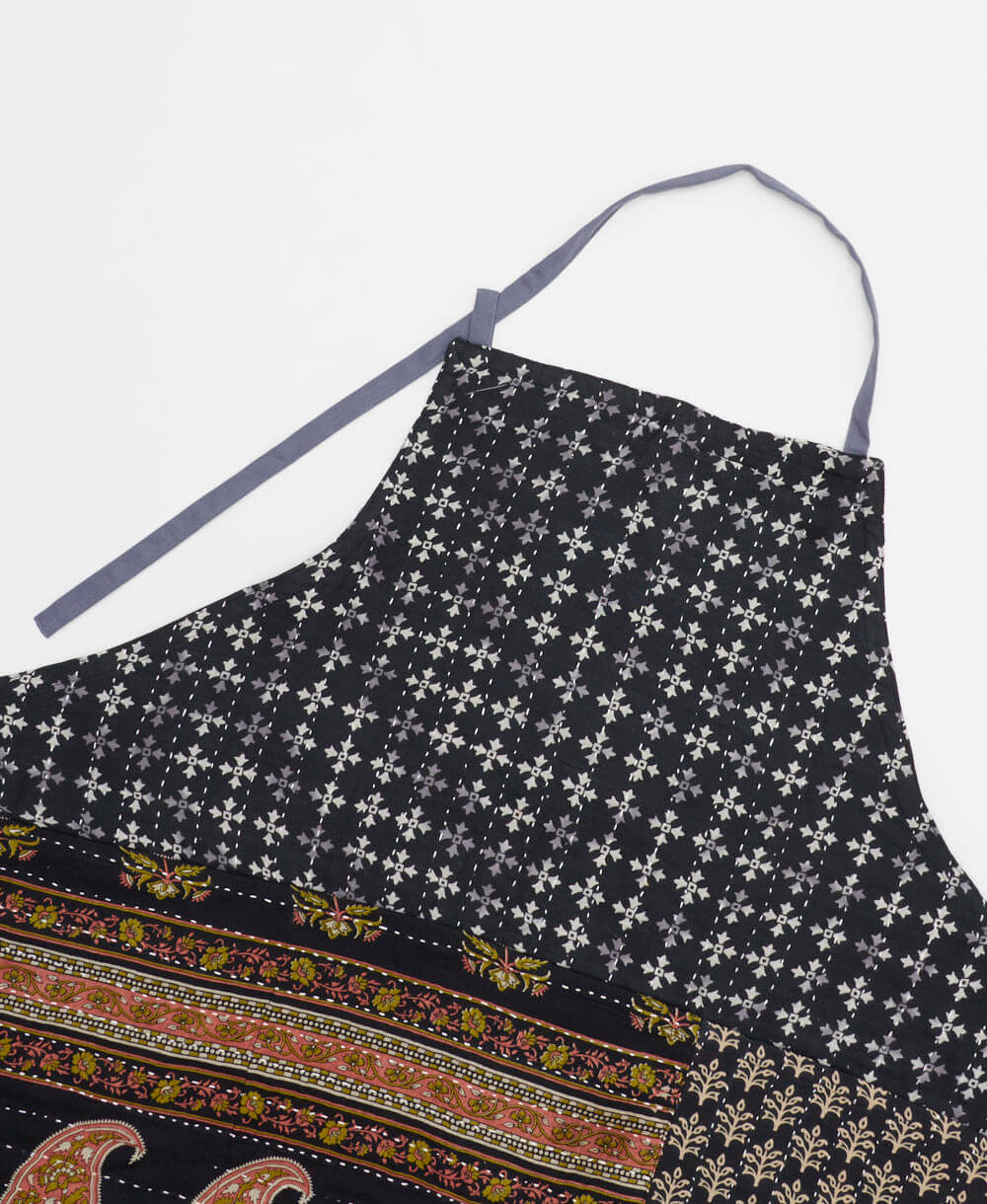 sustainable adjustable apron in black paisley print made from one-of-a-kind saris with white embroidery