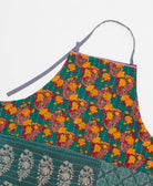 sustainable adjustable apron in teal & orange floral print made from one-of-a-kind saris with white embroidery