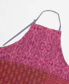 sustainable adjustable apron in magenta pink paisley print made from one-of-a-kind saris with yellow embroidery