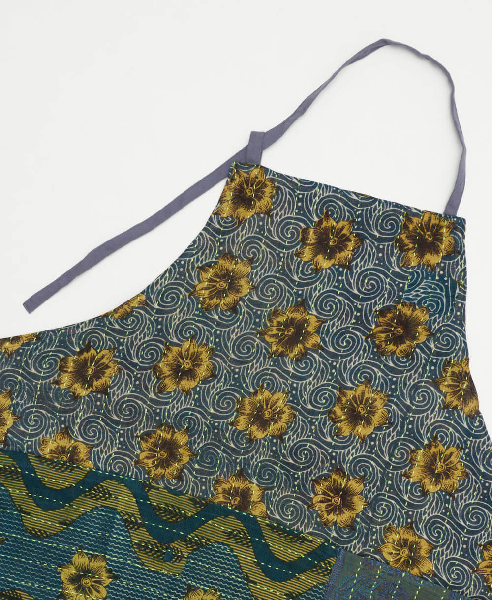 sustainable apron for gardening or baking in a navy blue fabric with golden floral print