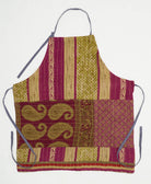 adjustable apron in a magenta and olive green striped paisley print with adjustable neck and waist ties