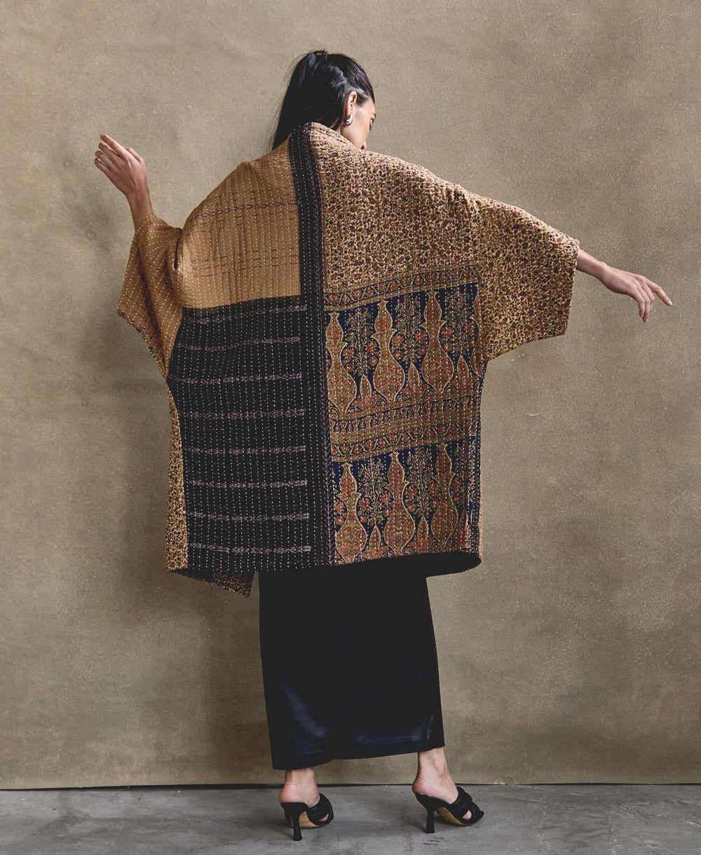 modern kantha quilted jacket in oversized cocoon shape made from one-of-a-kind vintage cotton saris in India