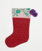 crimson red holiday stocking with turquoise floral border with purple pom poms