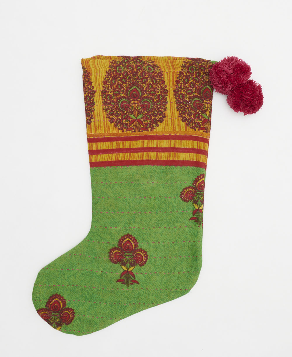 bright green holiday stocking in maroon bouquet print with pink pom poms