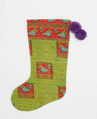 pear green holiday stocking in novelty parrot print with purple pom poms