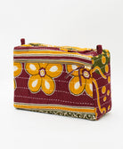 large toiletry bag sustainably made featuring a burgundy and mustard floral print 