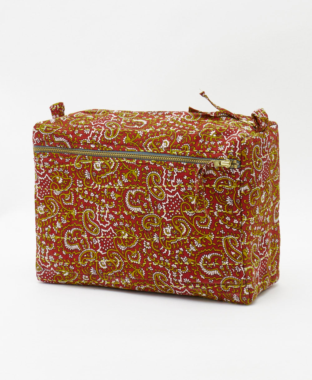 large toiletry bag in a brick red paisley print handmade by artisans in india 