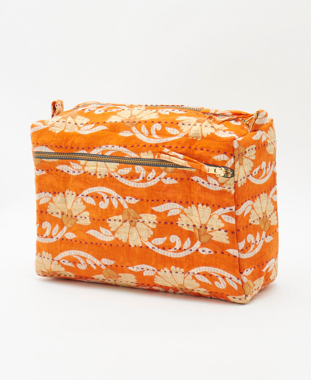 one-of-a-kind large toiletry bag featuring a tangerine orange floral print 