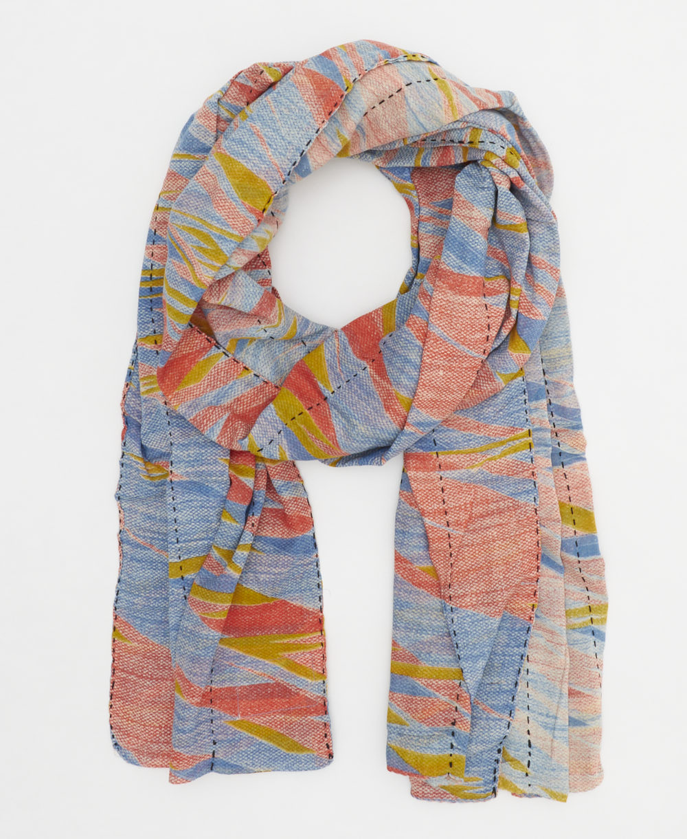 lightweight scarf in shades of coral, cornflower blue and yellow creating a watercolor abstract pattern