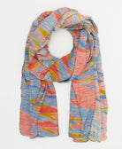 lightweight scarf in shades of coral, cornflower blue and yellow creating a watercolor abstract pattern