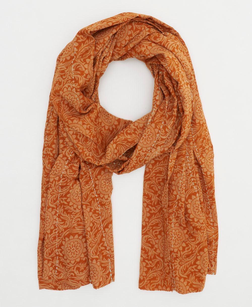 lightweight cotton scarf in a muted orange hue in a sunflower print made from vintage saris