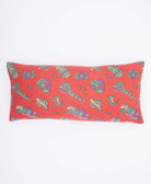 coral red lumbar throw pillow with purple & green instruments printed on front