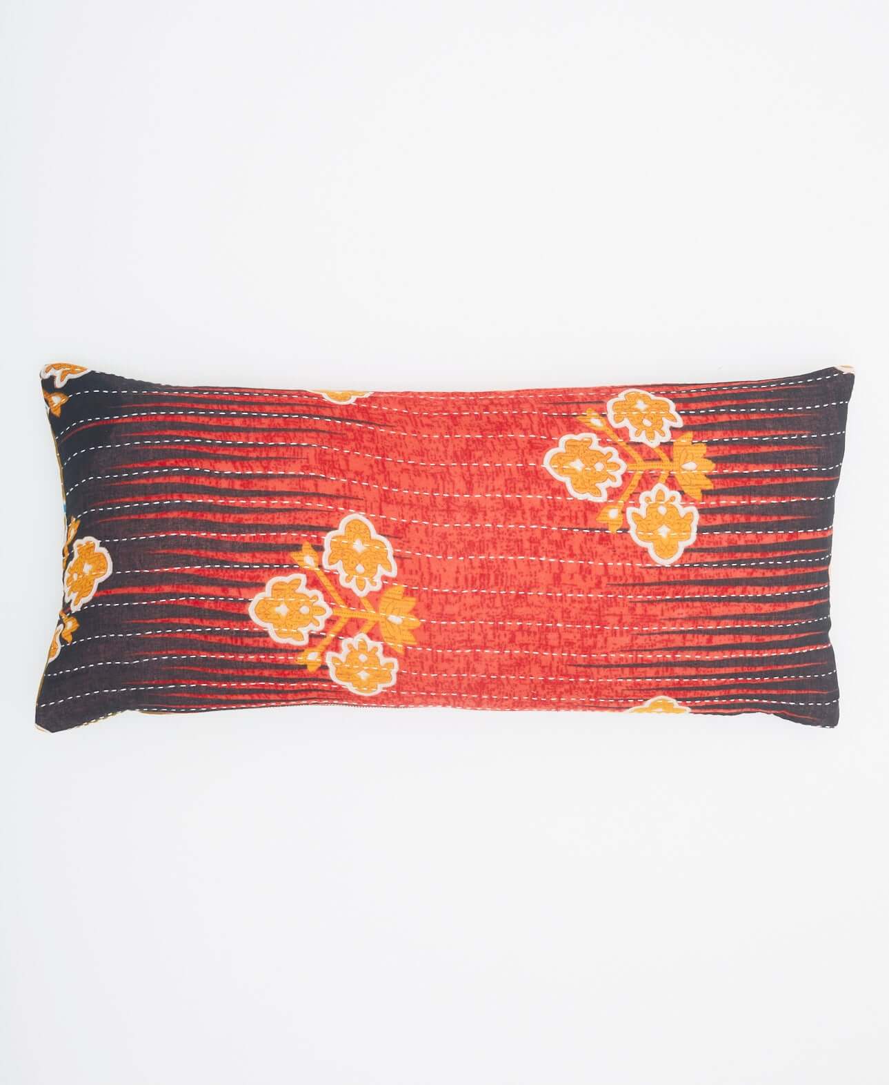 coral lumbar throw pillow with black and orange flower accents