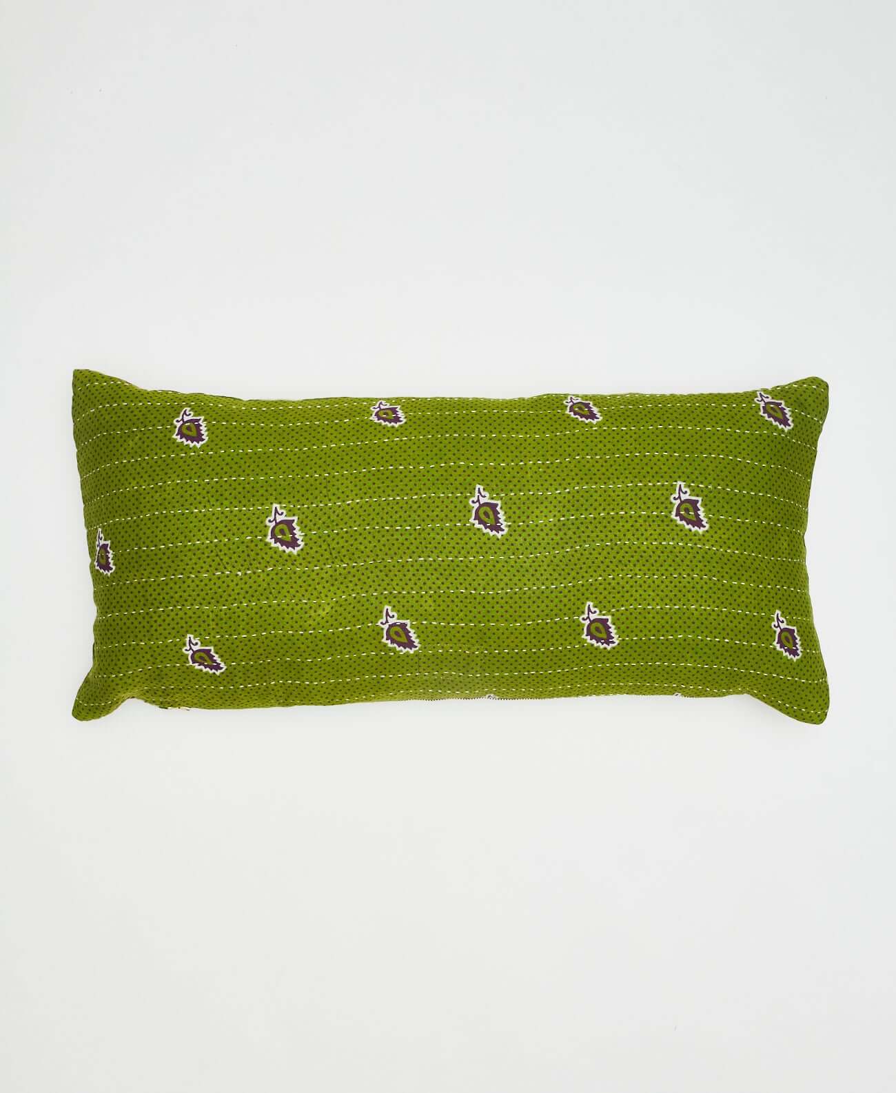 reversible lumbar pillow in bright green with tiny dark green dots