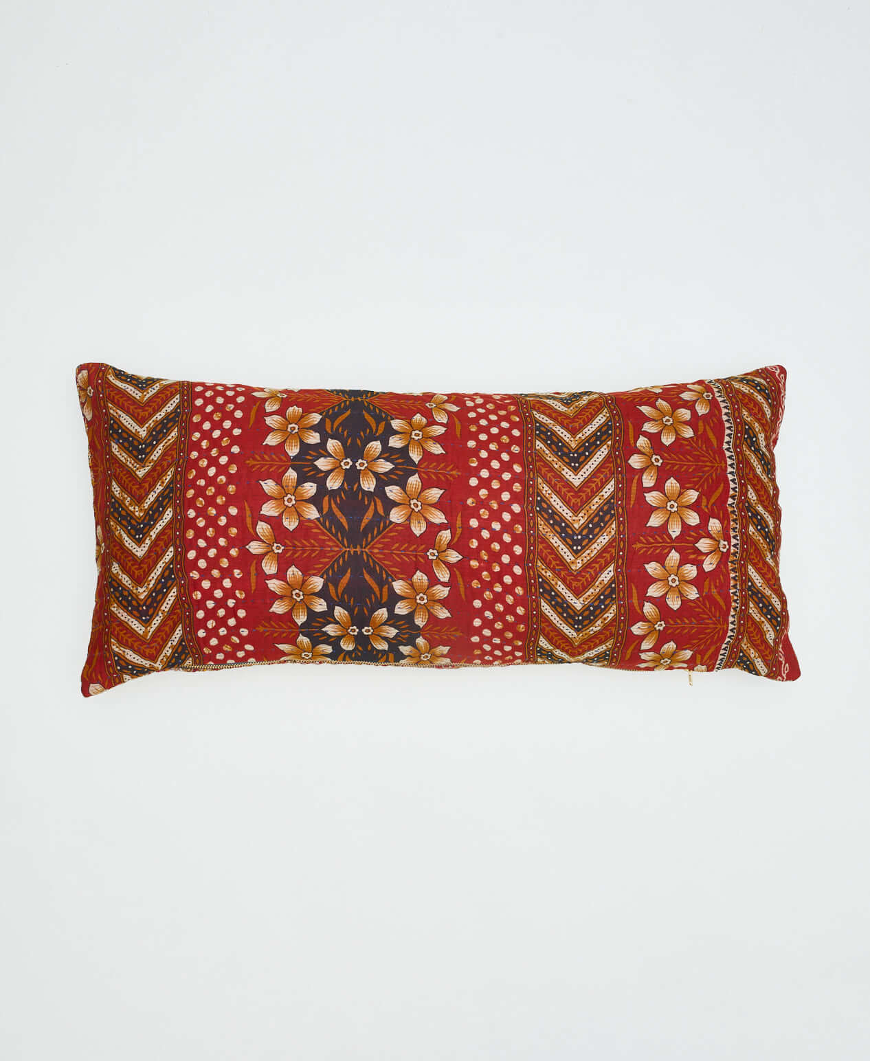 reversible lumbar pillow made from upcycled cotton saris in India with a red and orange floral print