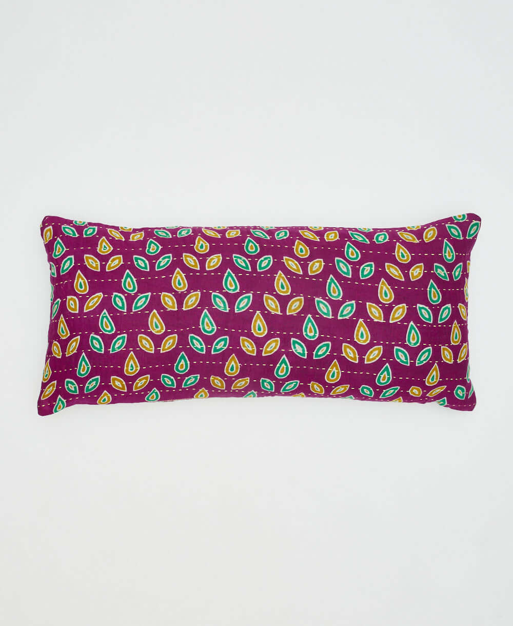 warm purple lumbar pillow with bright green & sunny yellow teardrop shaped pattern