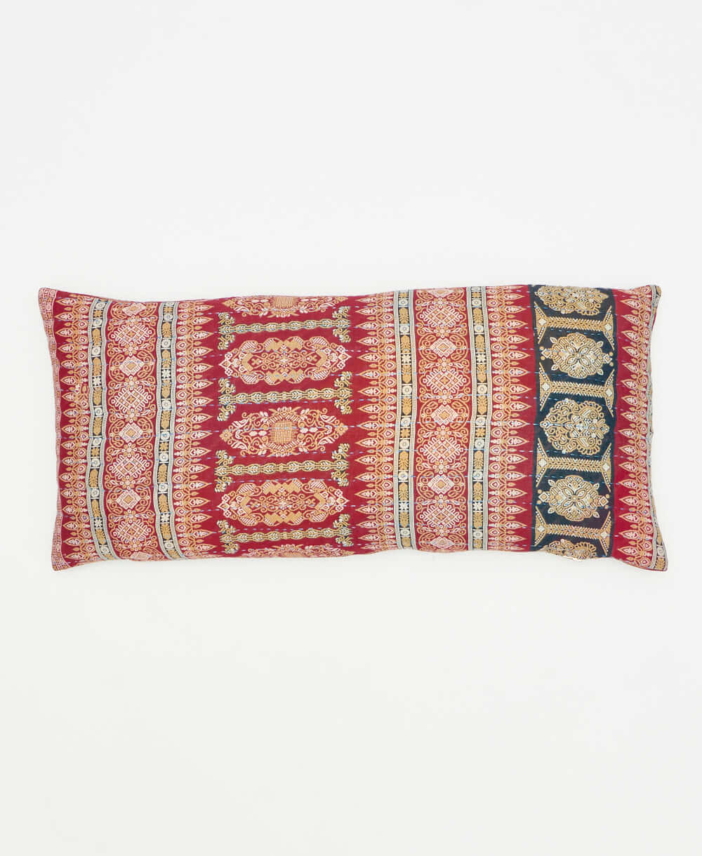 ethically made lumbar throw pillow featuring a unique orante pattern 