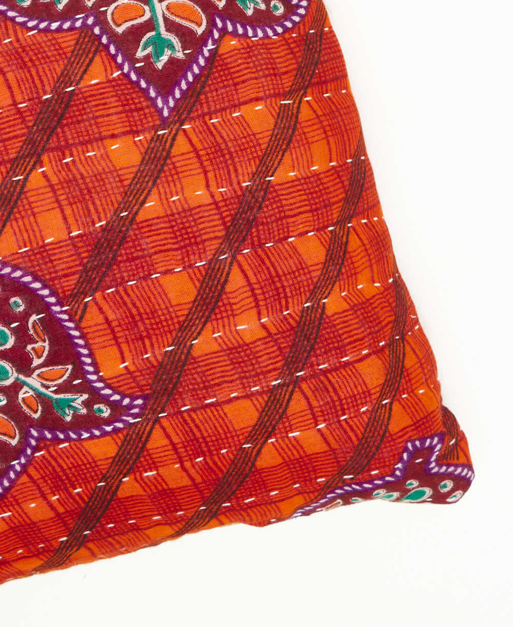 one of a kind orange lumbar pillow featuring white kantha hand stitching 