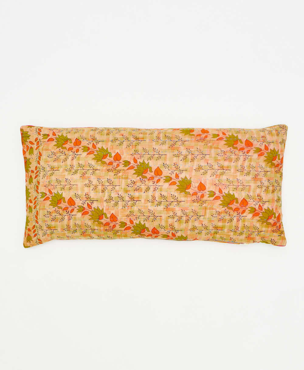 lumbar pillow featuring a classic orange and green floral pattern