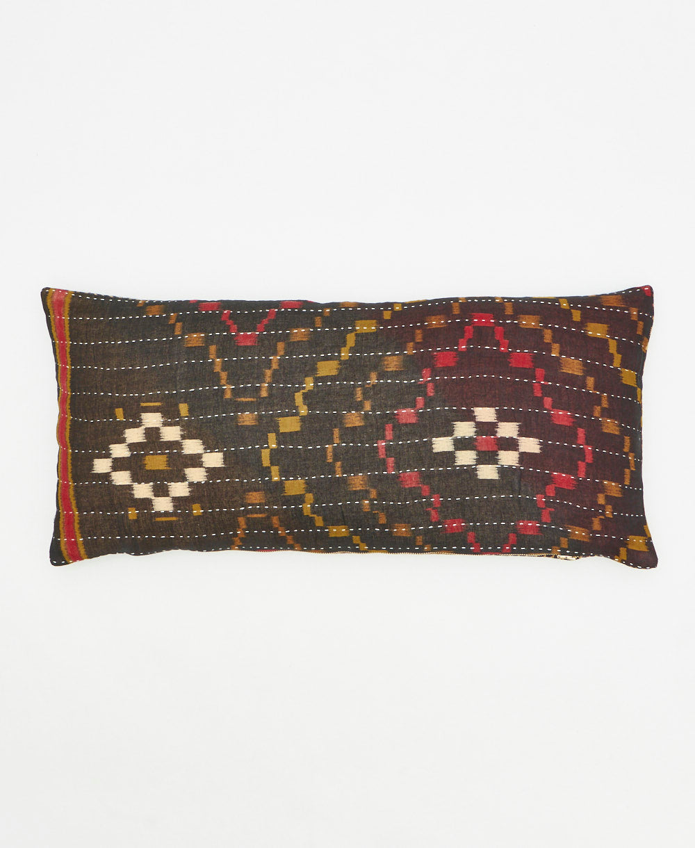 lumbar pillow featuring a graphic diaomnd print and traditional hand stitching 