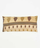 lumbar pillow made using tan and brown leaf print cotton saris 