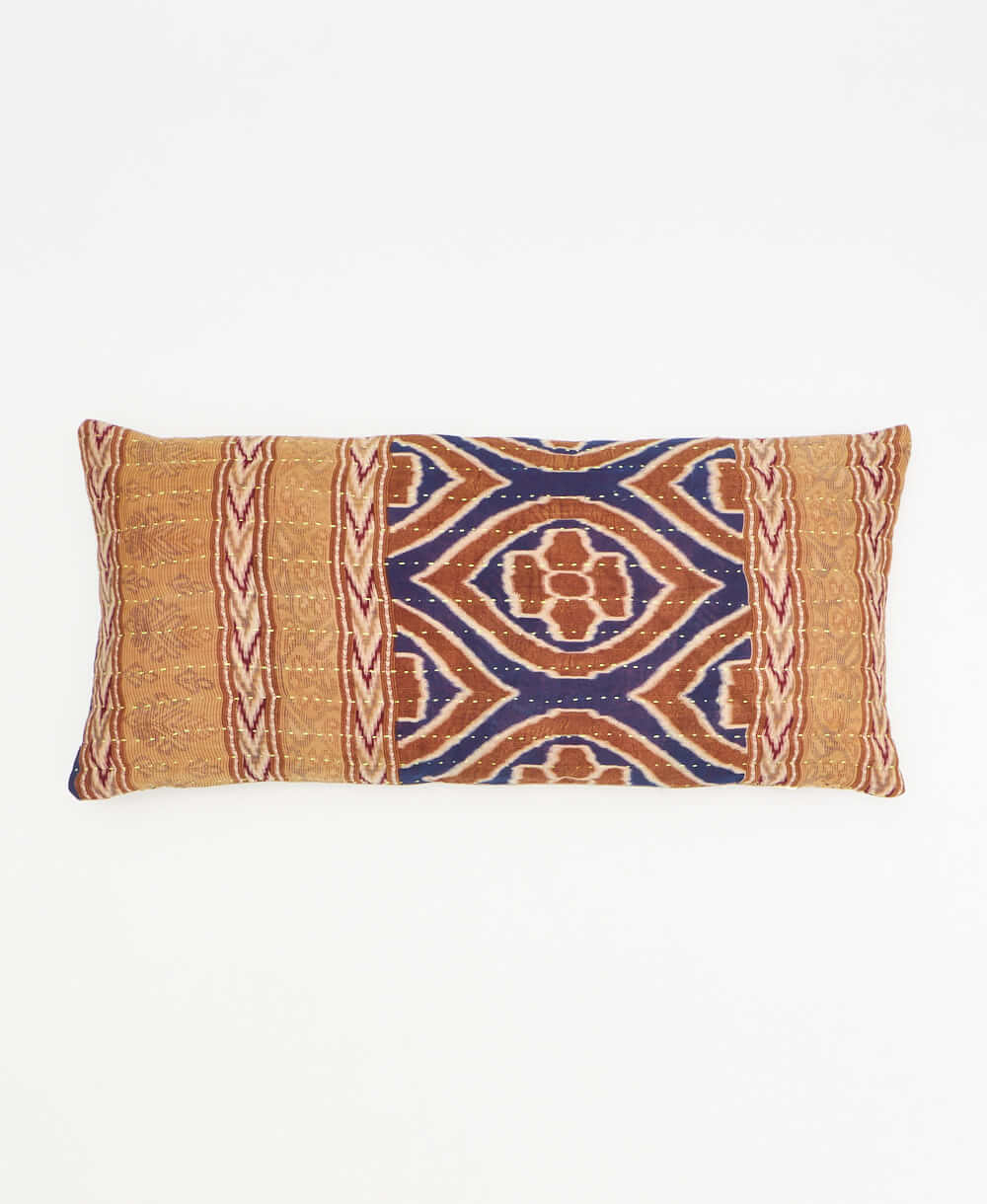 reddish-tan lumbar pillow with brown & blue diamonds made from upcycled vintage cotton saris in India