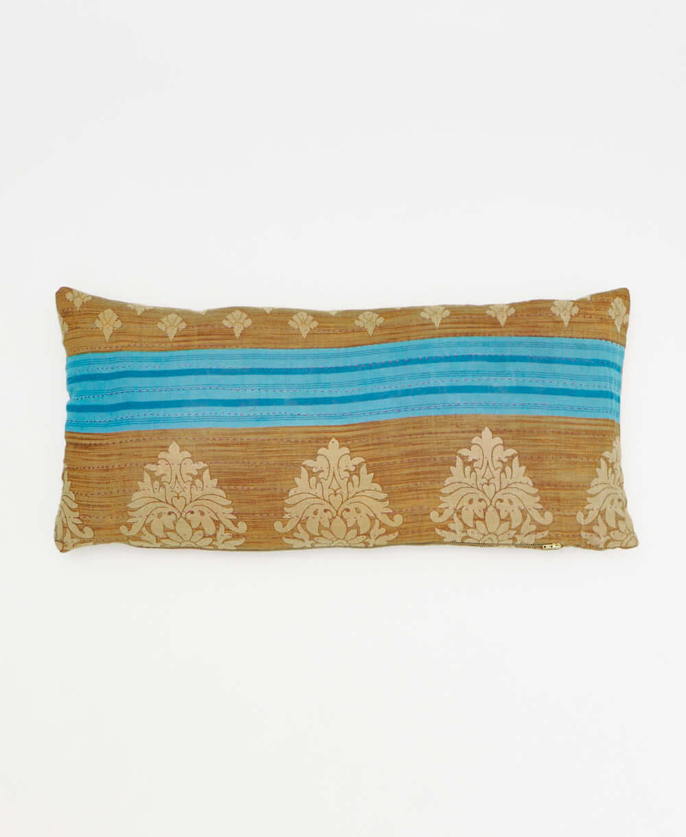 light brown lumbar pillow with a sky blue stripe print made from upcycled vintage cotton saris in India