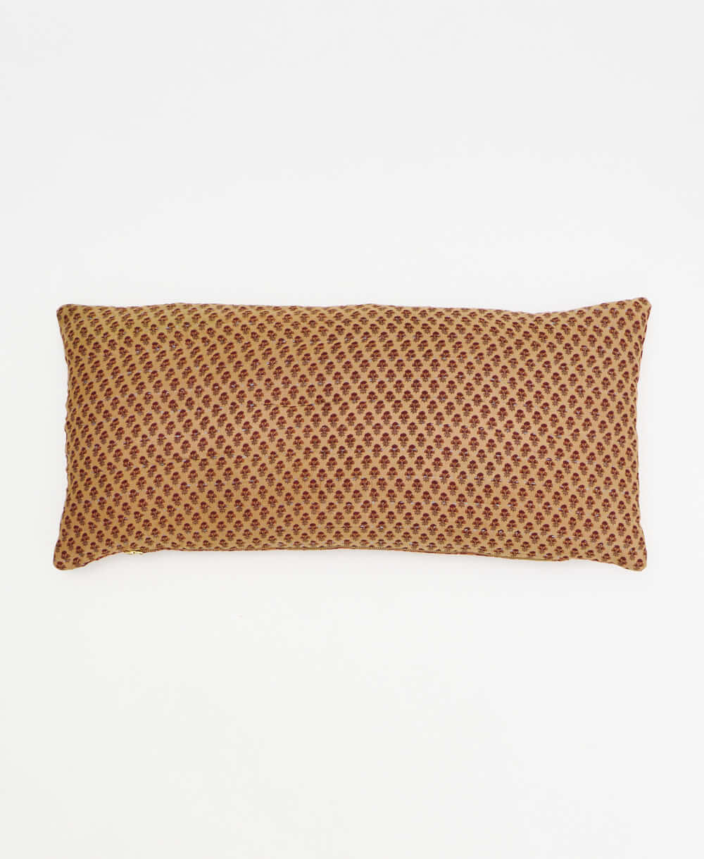 tan lumbar throw pillow with tiny maroon daisy print handmade in India by women artisans by Anchal