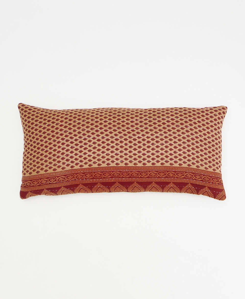 light sand lumbar pillow with maroon leaf print made from upcycled vintage cotton saris in India