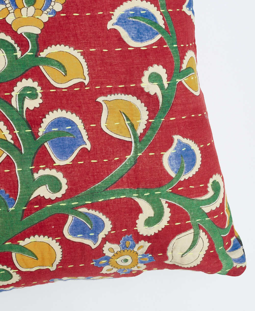 sustainable lumbar pillow in cherry red & green vine print with neon green embroidery