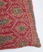 sustainable lumbar pillow in burgundy red and black medallion print with neon green kantha embroidery