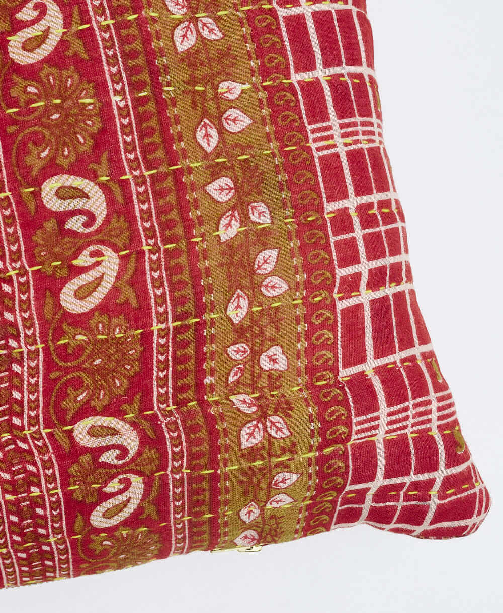 sustainable lumbar pillow in bright red and camel medallion print with neon green kantha embroidery