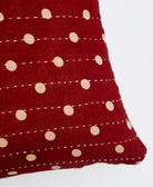 sustainable lumbar pillow in crimson red & tan polka dotted print with white kantha embroidery