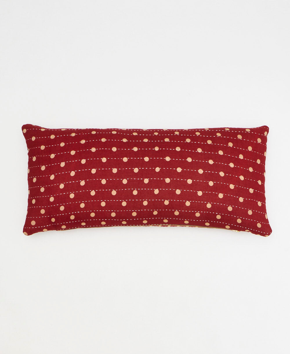 crimson red lumbar pillow with sandy polka dot print made from upcycled vintage cotton saris in India