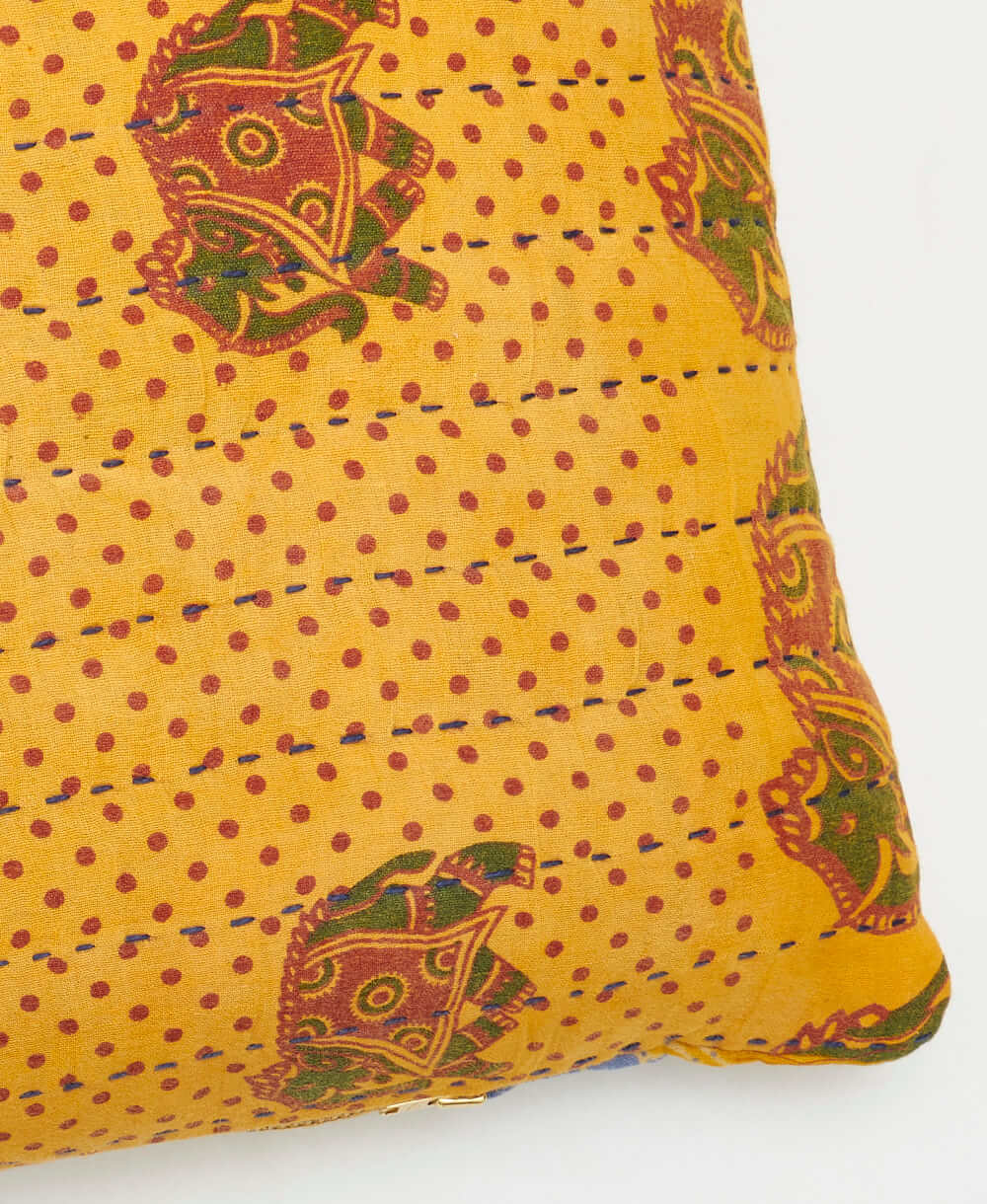 sustainable lumbar pillow in golden yellow elephant print with black kantha embroidery