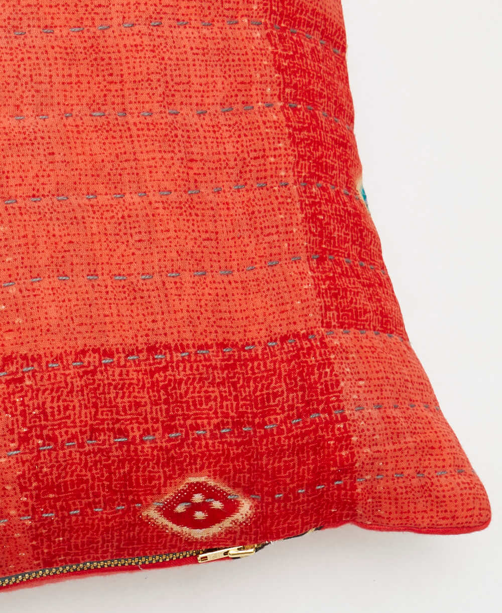 sustainable lumbar pillow in coral red & teal diamond print with grey kantha embroidery