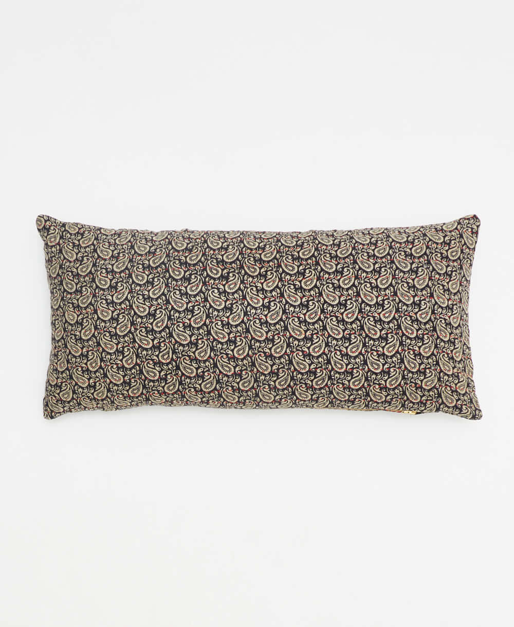 black lumbar pillow with a grey paisley print made from upcycled vintage cotton saris in India