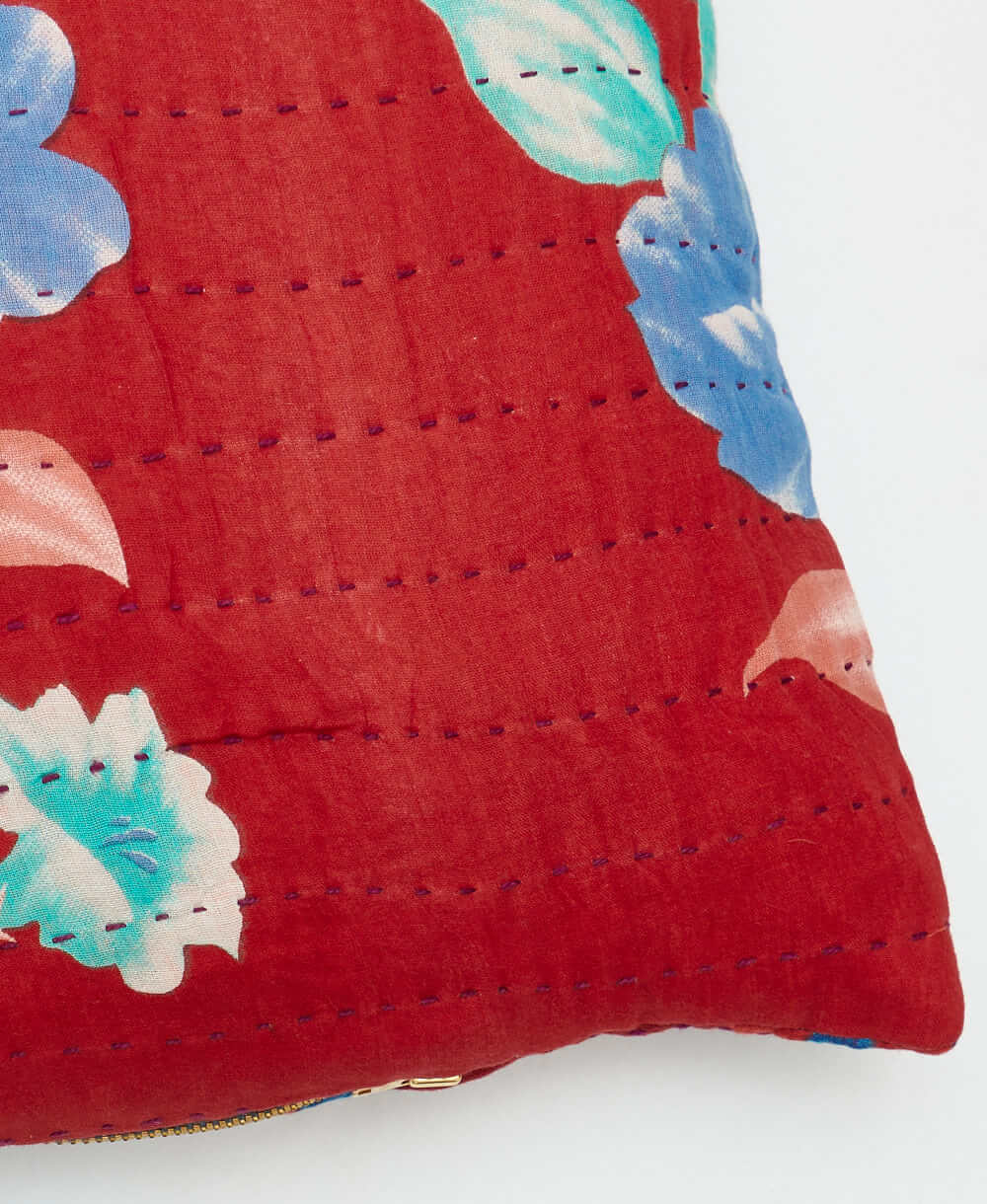 sustainable lumbar pillow in red & bold blue floral print with purple kantha embroidery