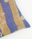 lumbar pillow in blue & tan floral stripe print with orange kantha stitching