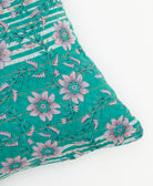 lumbar pillow in teal & lavender floral print with orange kantha stitching
