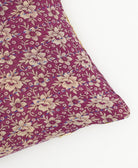 lumbar pillow in magenta purple and ivory floral print with purple kantha stitching