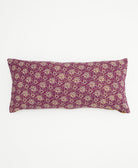 magenta purple lumbar pillow with an ivory floral pattern
