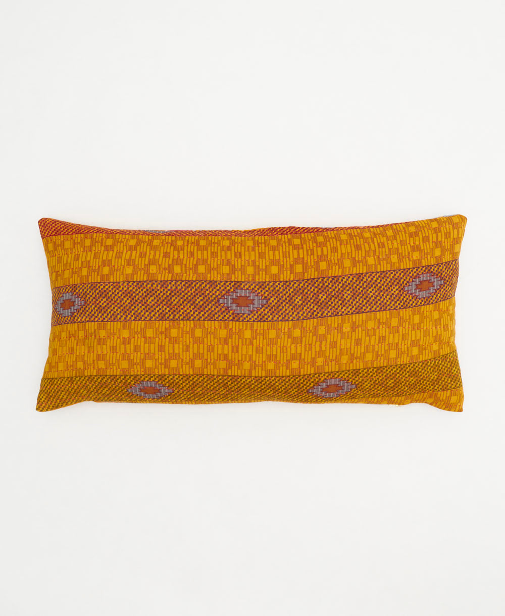 golden yellow lumbar pillow with orange stripe