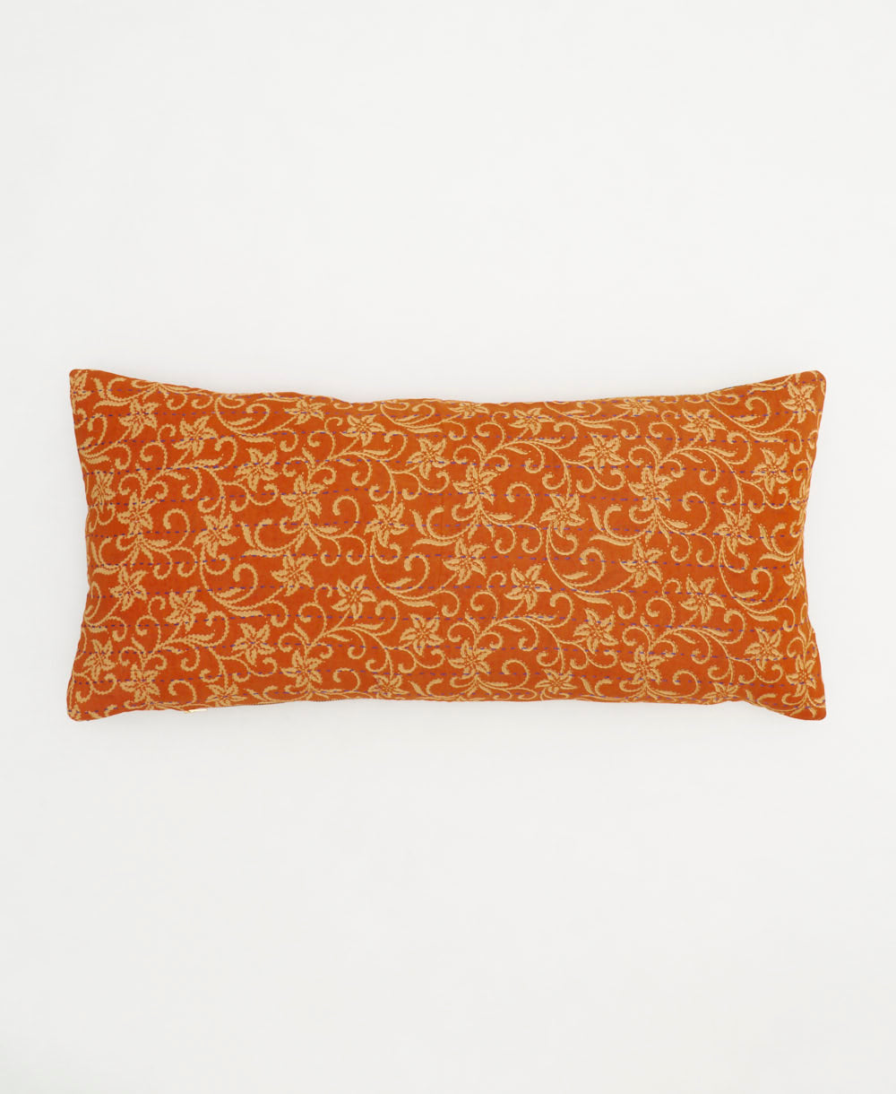 sunset orange lumbar throw pillow with beige florals