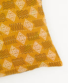 lumbar pillow in mustard yellow and white geometric diamond