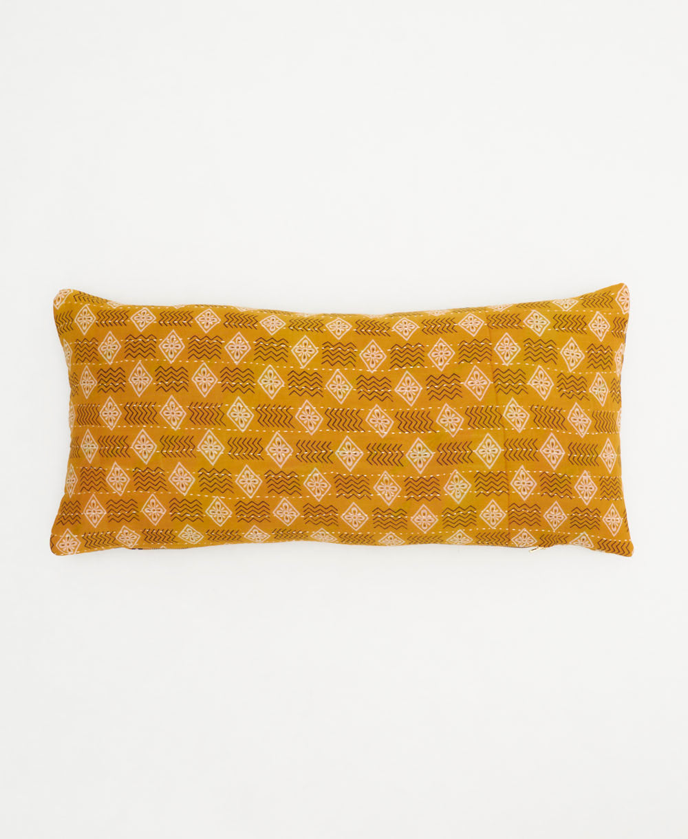 mustard yellow lumbar pillow in geometric white diamond print