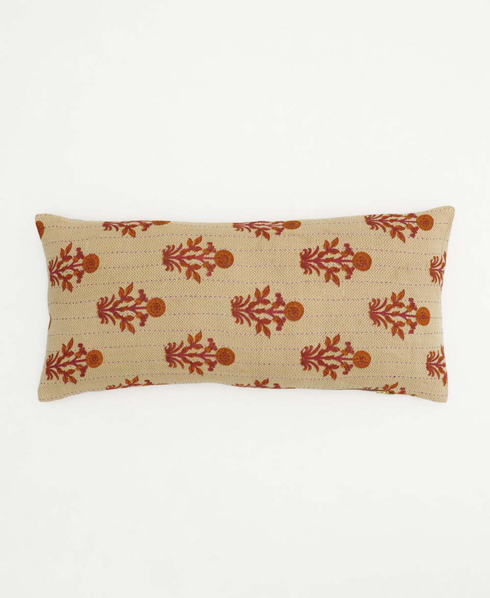 beige lumbar pillow with rust florals