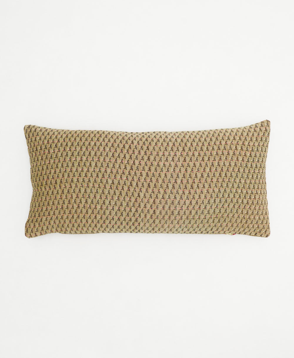 beige lumbar pillow with tiny black flowers