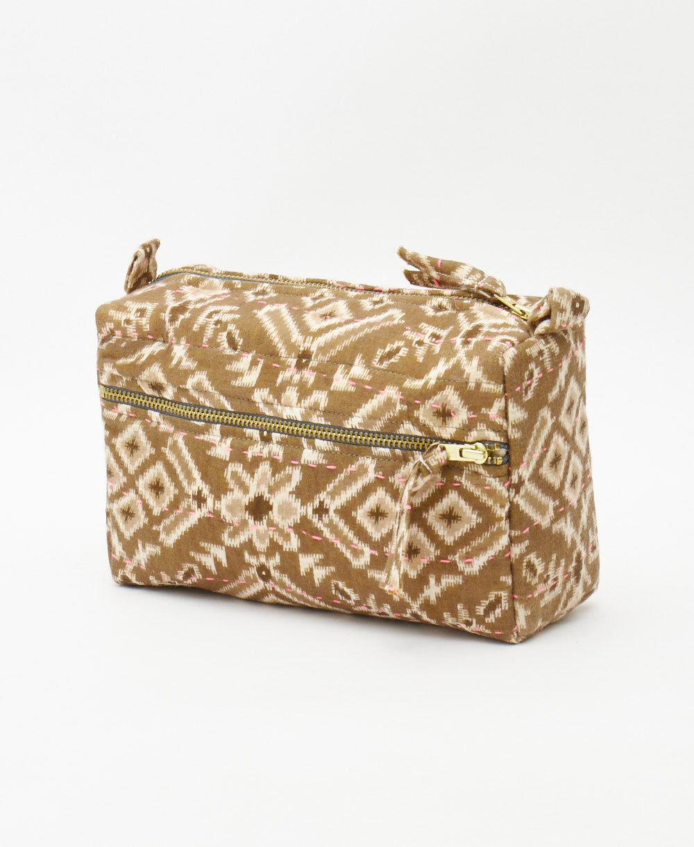 brown and cream ikat print medium toiletry bag featuring pink traditional kantha hand stitching 