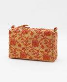 cosmetic travel bag in a tan & muted red floral print with purple hand-stitched kantha embroidery